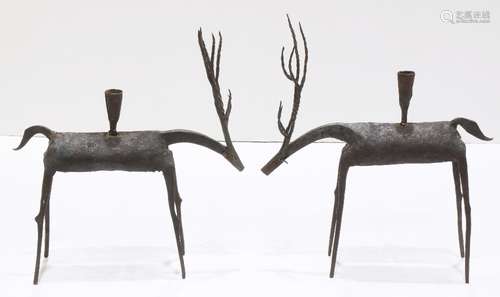 Pair of Moderne patinated metal figural candlesticks, each having a single light above a deer form