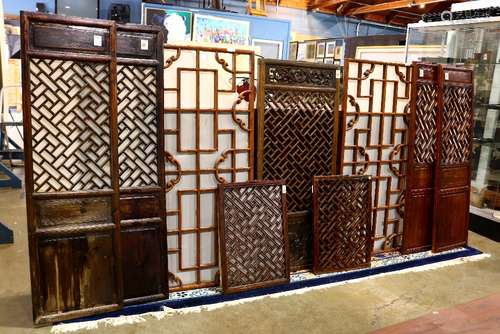 (lot of 9) Chinese reticulated wood panels, seven of openwork wanzi pattern; together with a pair