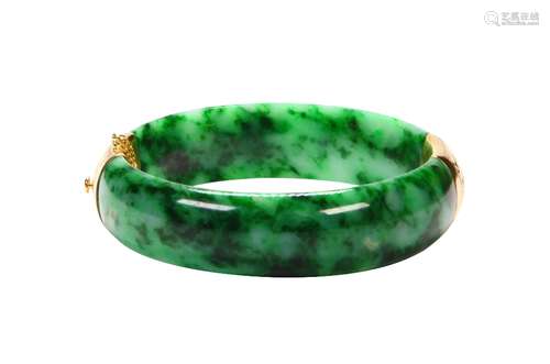 Jadeite and 14k yellow gold bracelet Featuring (2) carved jadeite segments, measuring