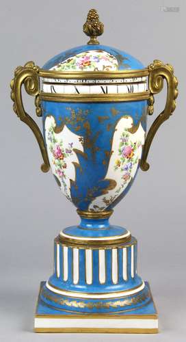 Sevres clock vase with dore bronze mounts and bright blue ground, the base with a conjoined L