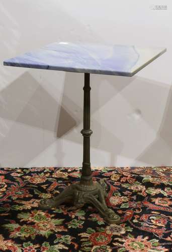 French bistro table, having a square marble top, above a patinated metal base, 29