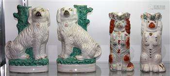 (lot of 4) Staffordshire style pottery figural group, consisting of a pair of spaniel slip vases,