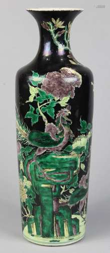 Chinese famille noir porcelain vase, the tall tapering body featuring a pair of phoenix amid large