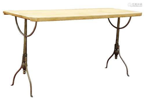 French cafe style custom bistro table, having a butcher block top, above the chromed metal base,