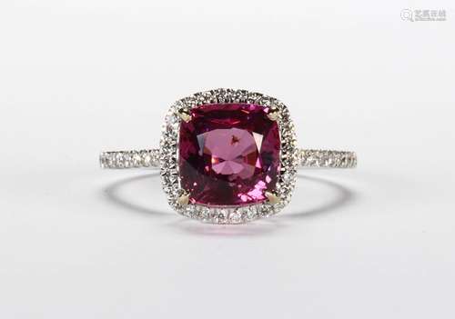 Spinel, diamond and 14k white gold ring Centering (1) cushion-cut spinel, weighing approximately 2.