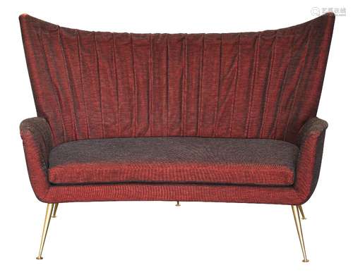 Italian Modern sofa, circa 1950, in the manner of Gio Ponti, executed in burgundy, having a wing