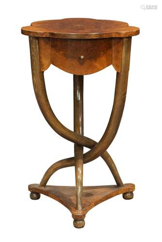 French occasional table, circa 1900, having a shaped top above the conforming case with a single