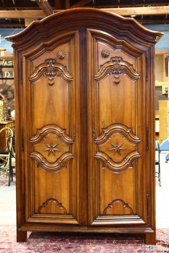 French Baroque walnut armoire, Lyon, 1700's, having a molded cornice above two paneled doors, each