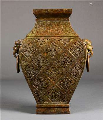 Chinese bronze hu vase, of rectangular section molded with a floral diaper pattern, flanked by