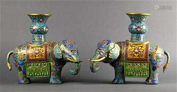 Pair of Chinese cloisonne enameled vessels, each of a carparisoned elephant supporting a gu-vase