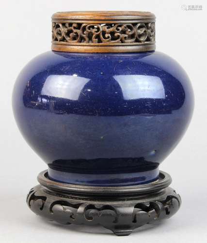 Chinese cobalt blue glazed porcelain jar, with a compressed body raised on a low foot ring, with