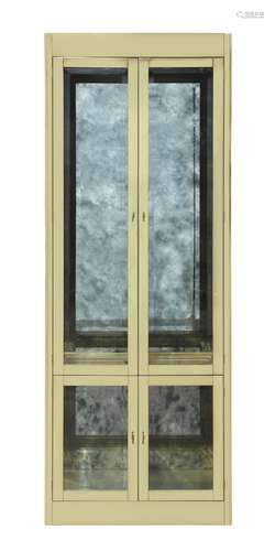 Moderne Mastercraft vitrine, having a brass exterior with four doors opening to the illuminated