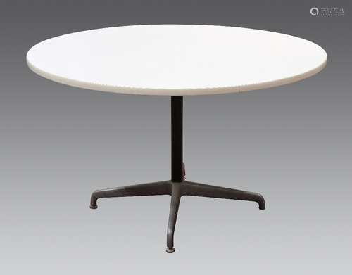 Mid-Century Modern dining table, in the manner of Charles and Ray Eames, having a circular white