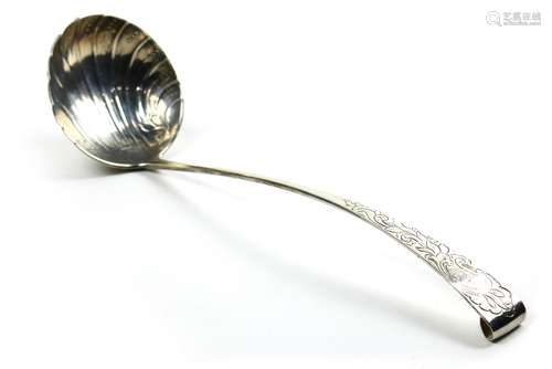 Sterling silver ladle, having a shell form bowl, the handle decorated with a foliate motif and