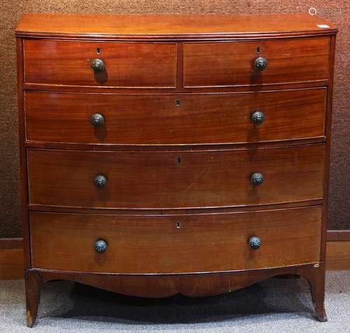 George III mahogany bow front chest, having a shaped crest, above the five drawer case, and rising