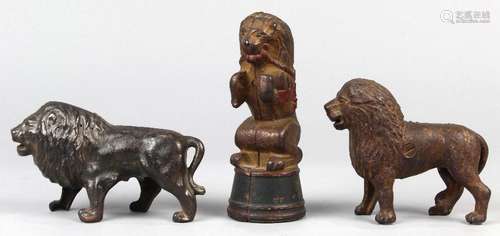 (lot of 3) Cast iron still lion penny banks, each modeled with a fluffy mane, one depicted as