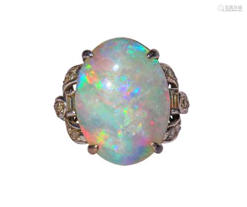 Opal, diamond and 10k white gold ring Centering (1) oval opal cabochon, measuring approximately 19 X