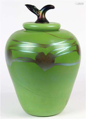 Iridescent art glass lidded sculptural jar depicting an apple, having a green body with heart shaped