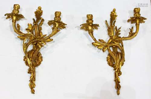 Louis XV style gilt bronze wall sconces, the two light fixtures with acanthus and floral scrolls