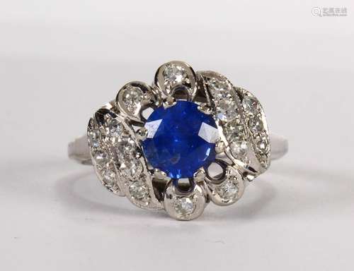 Sapphire, diamond and platinum ring Centering (1) round-cut sapphire, weighing approximately 1.20