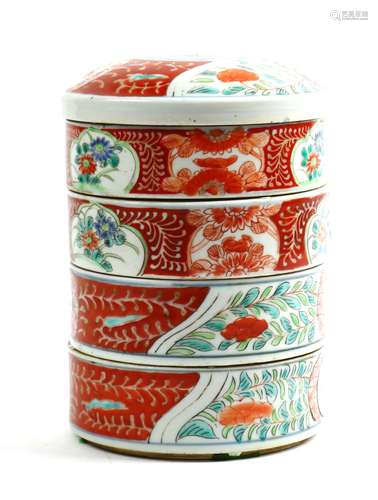 Japanese Imari four-tier food container decorated with various floral images in reserves, approx.