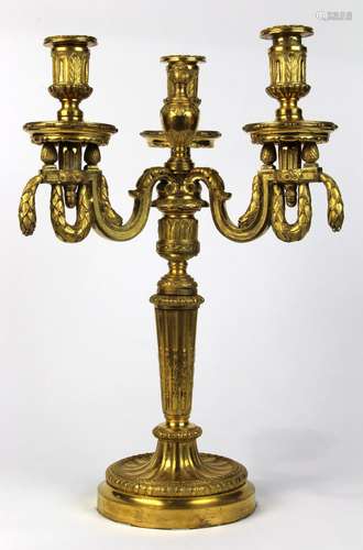 French Louis XVI gilt bronze candelabrum, having three arms with garland swag supports above the