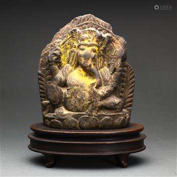 Himalayan polychrome stone Ganesha, seated in laliasana with various attributes in hand, raised on