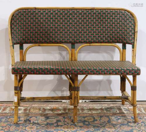 French bistro rattan bench, having a shaped back in green and brown caning, above the matching