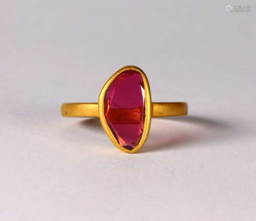 Tourmaline and 18k yellow gold ring Featuring (1) free-form tourmaline, measuring approximately 12.2