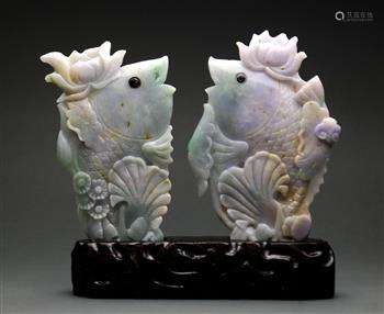 Pair of Chinese of jadeite fish, each topped with a lotus blossom on its head, and set into one wood