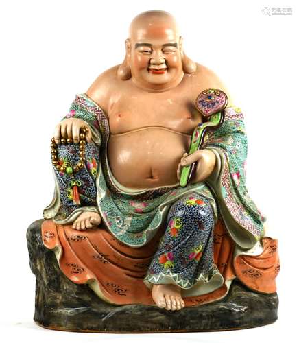 Chinese enameled porcelain Budai, seated in royal ease holding a ruyi scepter and a strand of prayer