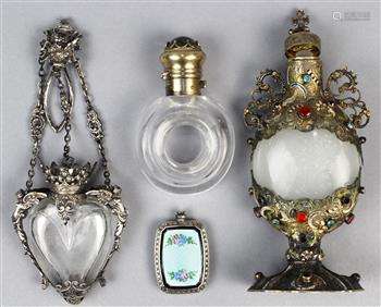 (lot of 4) Assorted silver and metal mounted glass perfume bottles, the first, a sterling silver