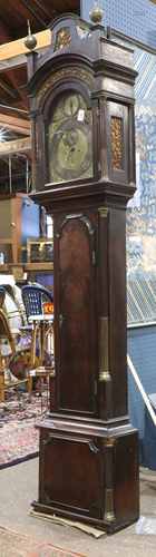 English George III tall case clock circa 1780, having a reticulated bonnet housing the brass