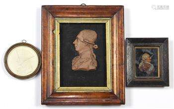 (lot of 3) Neoclassical style framed silhouette reliefs, comprising (2) wax reliefs, one depicting