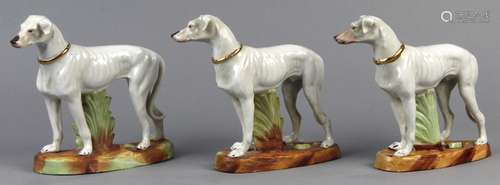 (lot of 3) German porcelain greyhound sculptural group, each white dog with a gilt enamel collar and