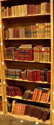 Six shelves of mostly leather bound books relating to literature, including 