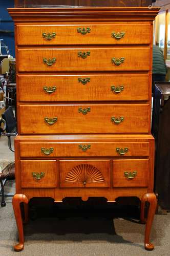 American Chippendale maple high boy, having a four drawer top, each with a tiger maple front,