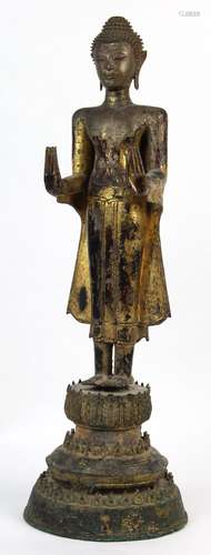 Thai bronze standing Buddha, with both hands in abhaya mudra, standing on a tiered lotus pedestal,