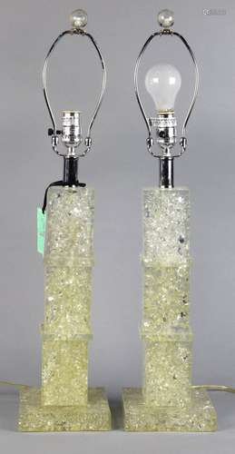 Pair of Mid-Century acrylic table lamps, each having a pillar form, in three cubes, above a plinth