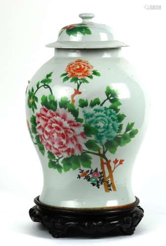 Chinese enameled lidded porcelain jar, featuring peonies on the globular body above the splayed