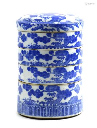 Japanese ceramic four-tier food container, blue-and-white transfer decorated with pines and