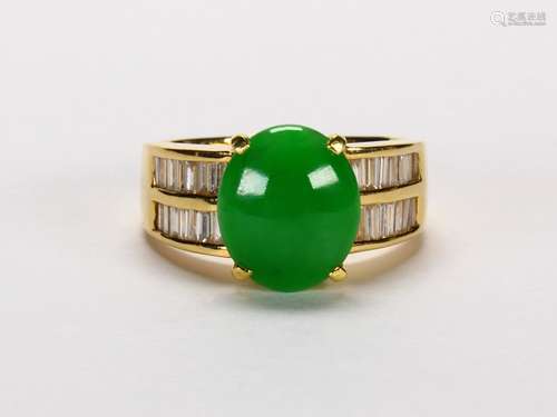 Jadeite, diamond and 18k yellow gold ring Featuring (1) oval jadeite cabochon, measuring