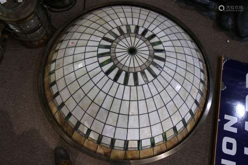 Arts and Crafts style leaded glass pendant lamp, having a dome form with carmel, cream and green