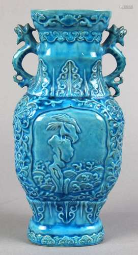 Chinese turquoise glaze porcelain vase, the shaped neck flanked by dragon handles, above the body