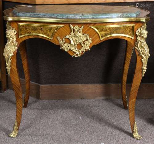 Louis XV style gilt bronze mounted marble top table, having an inset top above the bronze mounted