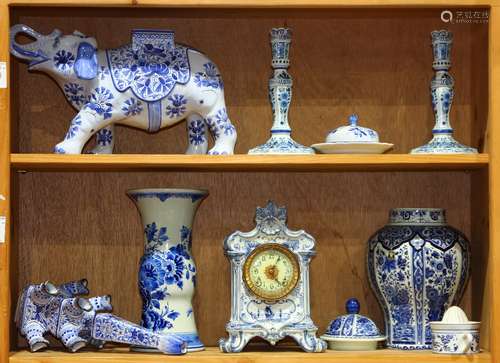 (lot of 9) Delftware and Delft style pottery group, comprising a pair of candle holders, having a