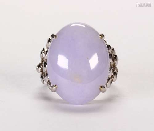 Jade and 14k white gold ring Featuring (1) oval jadeite cabochon, measuring approximately 24 X 17