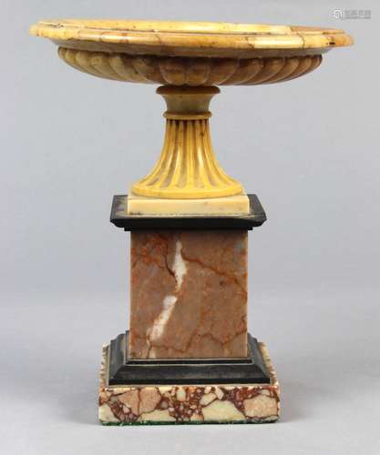 Neo-Classical style granite and marble carved garniture, the shallow variegated orange stone bowl,