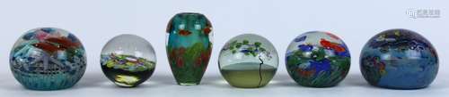 (lot of 6) Lundberg Studios art glass group, consisting of (5) paperweights, three decorated with