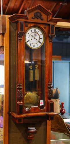 Austrian regulator clock, having a scroll decorated medallion above a Roman numeral dial, 45.5